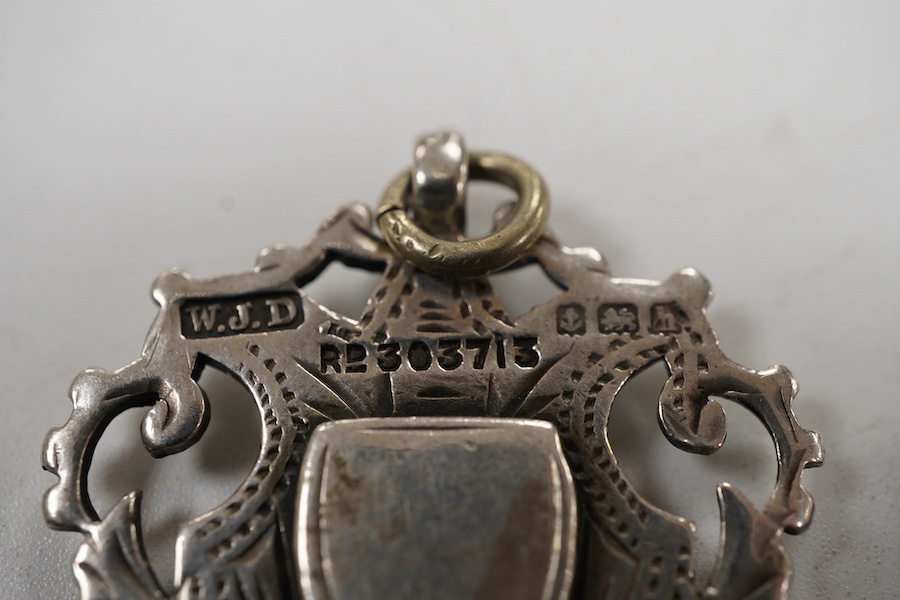 Five assorted early 20th century silver medals, including enamelled 'Luton District Football League, 1910/11', diameter 28mm.